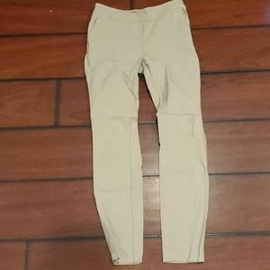 Tan ankle pull on dress pants.